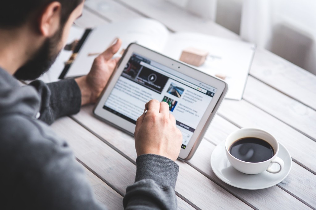 man reading articles