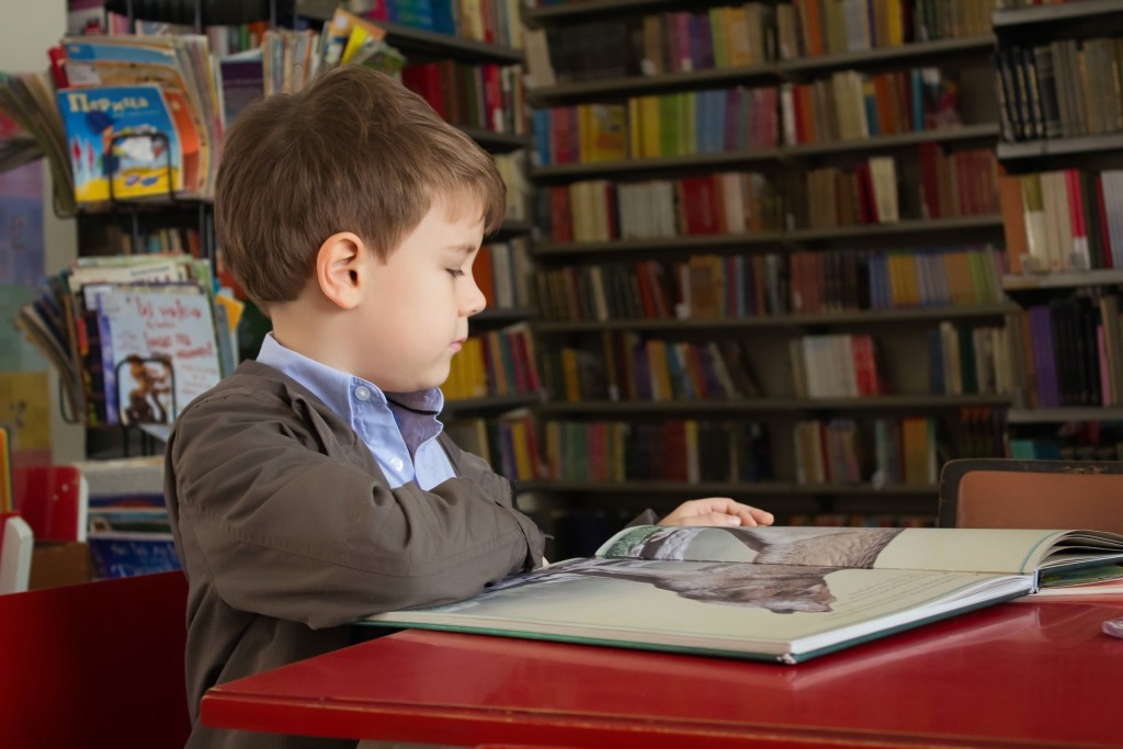 child reading book